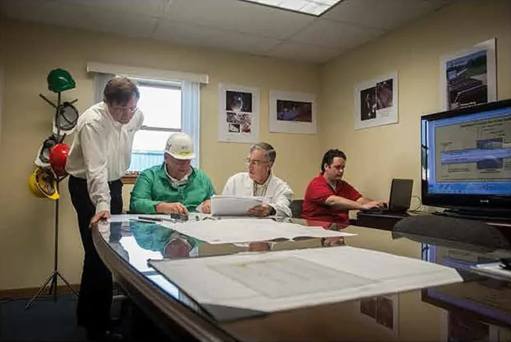 Several members from Fayette looking over plans