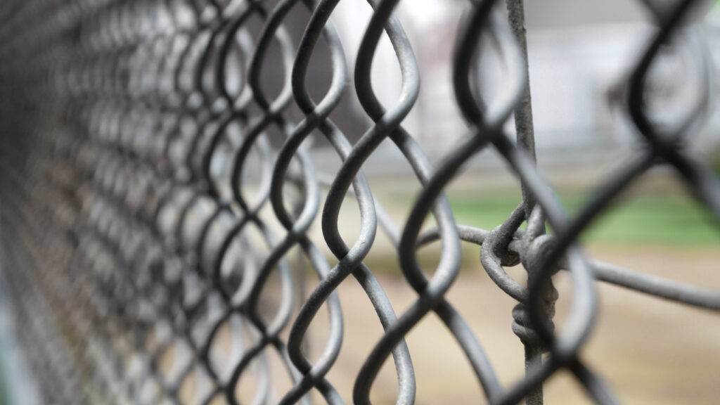 a close up of a chain link fence